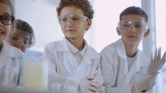 Lovely preteen scientists in white suits and eyeglasses clapping … [133278041] | 写真素材・ストックフォトのアフロ 