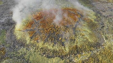 Africa landmark destination - aerial view smoking volcanic crater Dallol