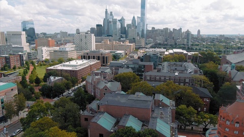 Aerial: University of Pennsylvania and city skyline. Philadelphia, USA