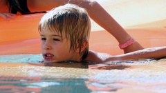 Candid meditative child inside swimming pool enjoying summer … [130944502] | 写真素材・ストックフォトのアフロ