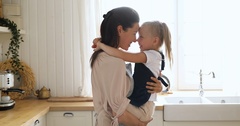 Happy loving young mother holding cute kid daughter embracing … [130749687] | 写真素材・ストックフォトのアフロ 