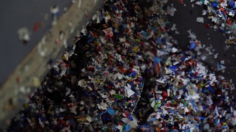 Plastic bottles PET flakes are washed in a washing container.