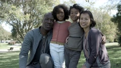 Asian mother, African American father and mixed-race kids posing [142027590] | 写真素材・ストックフォトのアフロ