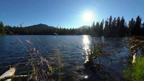 Cinematic tracking shot of alpine lake at Lassen Volcanic National Park, CA