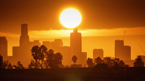 Downtown Los Angeles Sunrise over city buildings silhouettes. Timelapse, 4K UHD