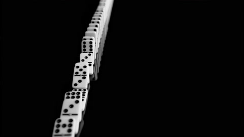 Domino effect: dominos falling in slow motion, wide tracking shot, 150fps