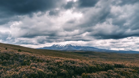 Dramatic grey stormy clouds over Mount Ruapehu volcanic mountains in New Zealand