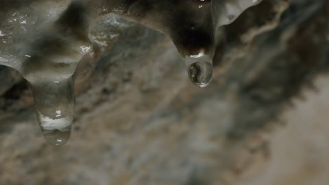 water drop of stalactite inside cave