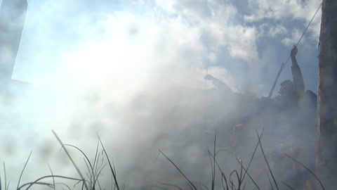 Civil War soldiers fighting in a staged combat battle with water explosion