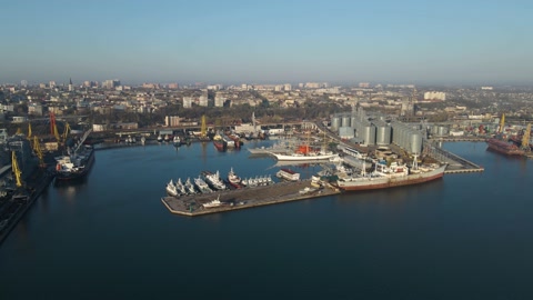 Aerial view of a cargo ship in the port dock Trade Export. Loading and unload