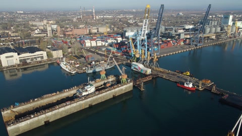 Aerial view of a cargo ship in the port dock Trade Export. Loading and unload