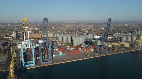 Aerial view of a cargo ship in the port dock Trade Export. Loading and unload