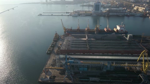 Aerial view of a cargo ship in the port dock Trade Export. Loading and unload