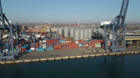 Aerial view of a cargo ship in the port dock Trade Export. Loading and unload