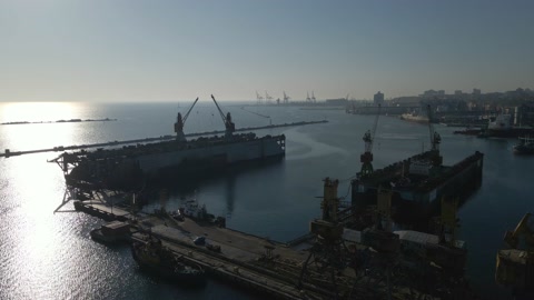 Aerial view of a cargo ship in the port dock Trade Export. Loading and unload