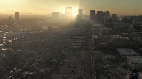 Aerial: Phoenix city skyline at sunset, Arizona, USA