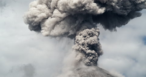 Mushroom cloud forming after a violent volcanic eruption.