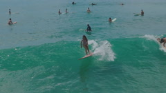 Young teen girl surfer surfing in Hawaii aerial drone [183826632] | 写真素材・ストックフォトのアフロ