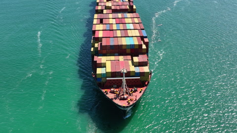 Container Ship at Sea Moving Cargo for International Trade