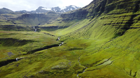 Iceland landscape, beautiful volcanic mountain river and waterfall at summer