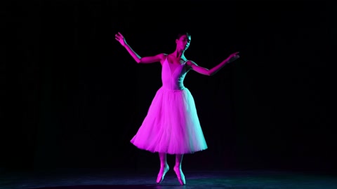 Young and beautiful graceful classical ballet female dancer in white dress