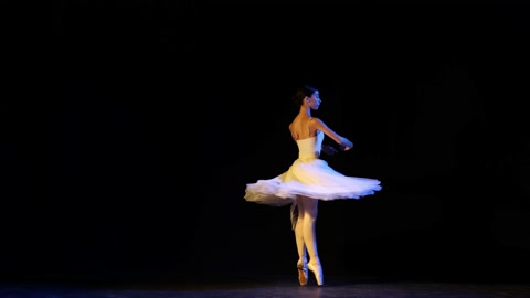 Young and beautiful graceful classical ballet female dancer in white dress