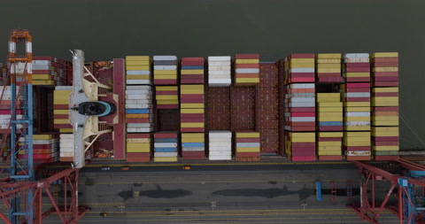 Aerial top down view Container vessel ship loading at pier - economy trade