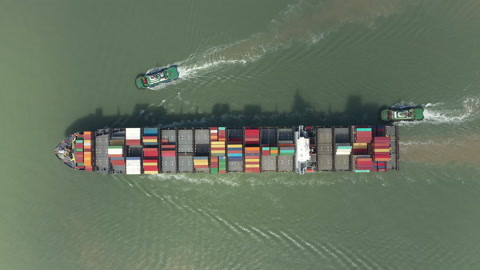 China overseas trade and globalization, aerial view tugboats and container ship