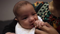Cute 2 Month Indian Baby Boy Sucking Mothers Finger And Smiling. … [204906148] | 写真素材・ストックフォトのアフロ