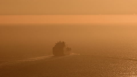 Fascinating trade ship floating towards open ocean waters