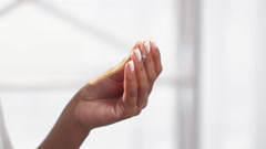 hand care woman rubbing fingers smearing cream [211012317] | 写真素材・ストックフォトのアフロ