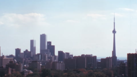 1970s Toronto Cityscape Sunny Day with CN Tower. Vintage 8mm Film Effect