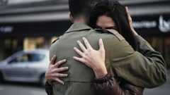 Young couple embrace in city street. Loving compassionate relationship. … [214676834] | 写真素材・ストックフォトのアフロ
