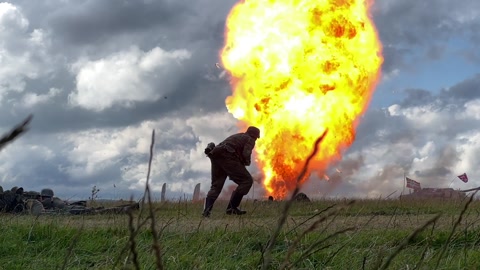 HUNSWORTH UK 12 AUGUST 2023 Slow motion explosion behind World War 2 soldier