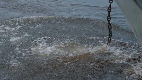 Metal anchor brings the trade ship carrying the products to a halt in the ocean