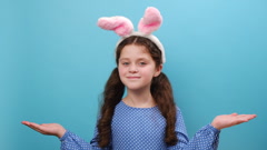 Portrait of preteen girl kid in bunny fluffy ears holds copy … [243389531] | 写真素材・ストックフォトのアフロ 