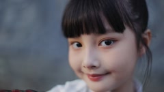 Close up of a young chinese girl smiling and winks at camera. [250742689] | 写真素材・ストックフォトのアフロ