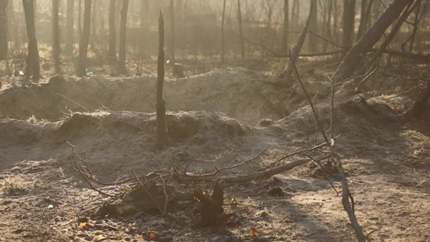 The explosion crater and rocket debris after. War in Ukraine.